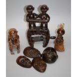 A 19th/20th century African carved hardwood yarn winder with figural surmounts, 32cm high together