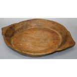 A large rustic hewn wood table bowl with angular handles. 58 x 46 cms.
