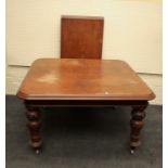 A Victorian, mahogany pull-out extending dining table with radiused  corners and single leaf insert.