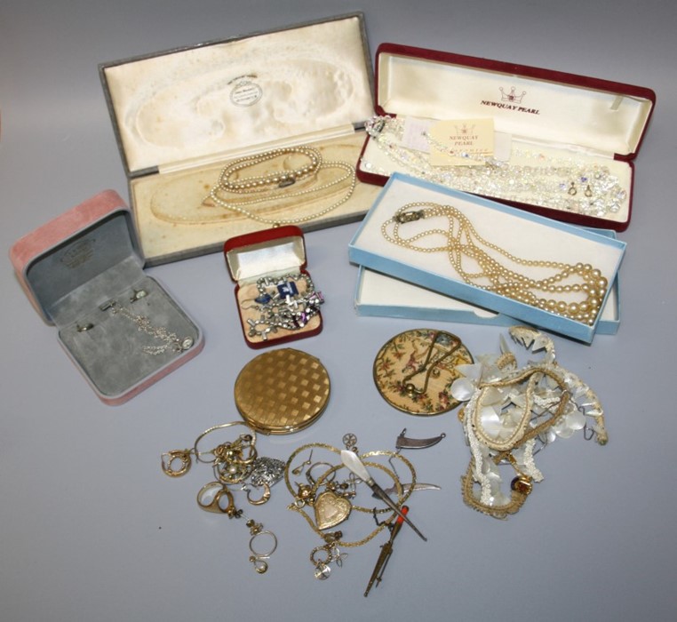 A collection of costume jewellery including shaped and engraved mother of pearl together with