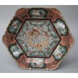 A late 19th Century Chinese hexagonal dish with shaped rim, centrally decorated with a three claw
