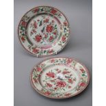 A pair of Chinese famille rose plates, Qianlong. Centrally decorated with peonies and finches within