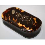 A Victorian tortoiseshell snuff box, the hinged cover florally decorated with silver and gold