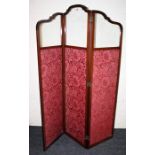 An Edwardian serpentine topped, mahogany three fold boudoir screen with glazed upper sections and