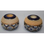 Two similar late 19th century Royal Doulton stoneware globular bar top strikers with bands of blue