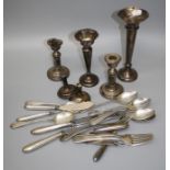 A collection of silver items including trumpet spill vase, candlesticks and other similar silver and