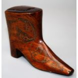 A 19th century treen snuff box fashioned as a boot with gold coloured pique trailing detail and