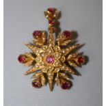 A late Victorian ruby and seed pearl brooch cum pendant, the six point star set with circular cut