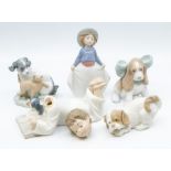 Five Nao figures of dogs and children with dogs