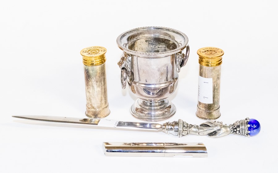 A pair Culinary Concepts silver plated novelty salts modelled as 12 bore shotgun cartridges together