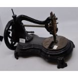 An early 20th Century table top sewing machine