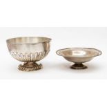 An Edwardian silver bowl, reeded rim plain top section above fluting on spreading circular foot,