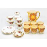 A 1930's hand painted lemonade set, six beakers, jug, along with Royal Albert and Royal Derby