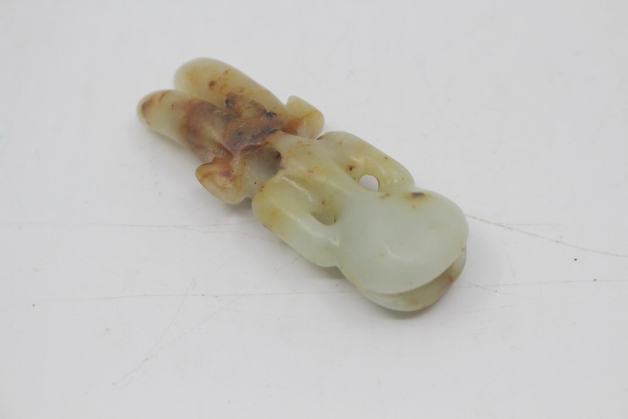 A Chinese pale celadon and russet jade amulet in the neolithic style, Qing Dynasty, of semi- - Image 3 of 3