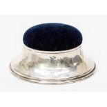 A George V silver raised circular pin cushion, flared body, London, 1921, maker's mark rubbed ?E,