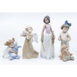 Three Nao figures, girl with violin and two young girls with toys and a Nao style angel