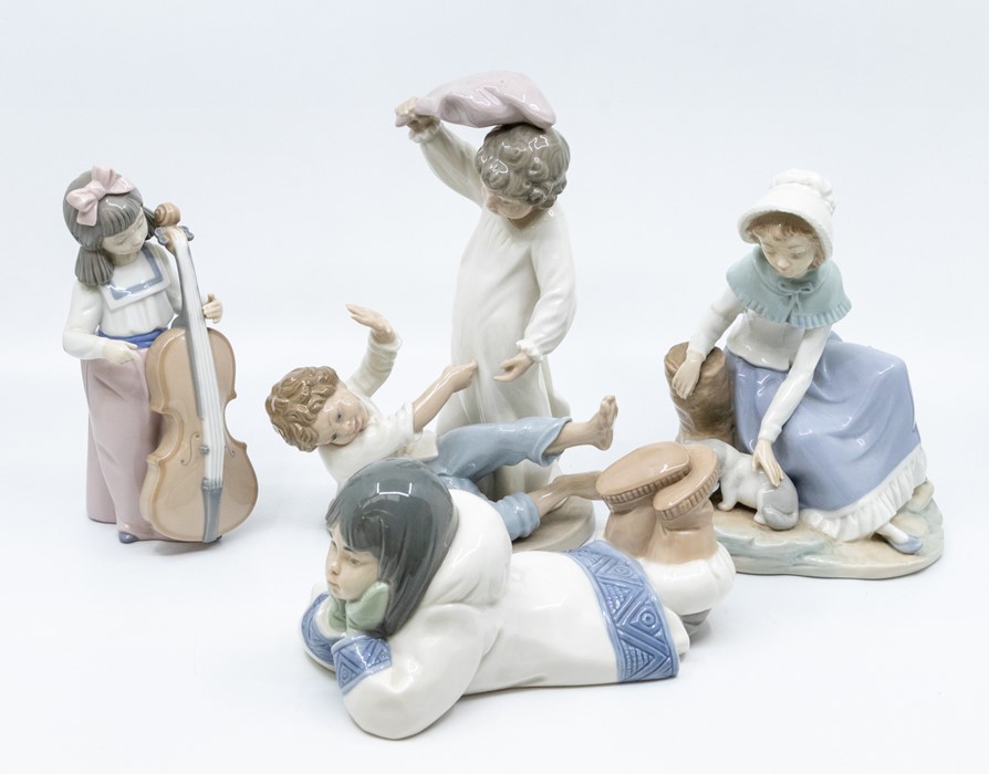 Four Nao figures of young children