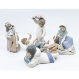 Four Nao figures of young children