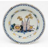 An 18th Century English Delft hand painted dish, decorated to underglaze with foliage, 22cms in