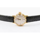 A gold plated ladies Omega wristwatch, round champagne dial with gold baton markers, case diameter