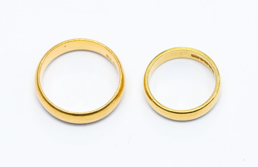 Two 22 carat gold wedding bands, 4mm and 5mm, sizes J and P1/2, combined total weight approx 11gms