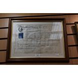 A framed indenture, 1869 along with etching of a 19th Century lady, on glass