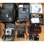 A box of assorted cameras and binoculars, including Kodak
