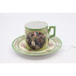 A Sevres style coffee can and saucer with Napoleon interest. Decorated with a painted scene and