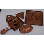 Newlyn School five pieces of Arts & Crafts copperware, comprising a chamber stick, square tray, oval