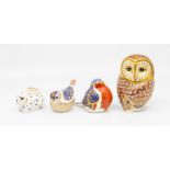 Four Royal Crown Derby paperweights with silver stoppers, including an owl, garden birds, and a