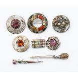 A collection of Scottish themed brooches to include silver and white metal set with hardstones and