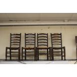 Four early 20th Century oak dining chairs with reeded seats