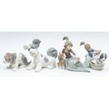 Four Lladro figures of dogs and small girls with dogs