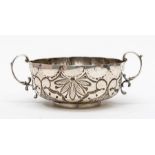A Continental white metal stamped 830 two handled loving cup, the sides chased and repousse with