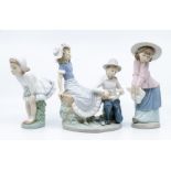 three Nao figures, boy and girl pair and two young girls
