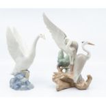 Two Nao figures of birds, stalks and geese