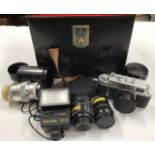 A collection of camera related items, including a 64R Super 8 Movie Camera, a Zorki 4K with