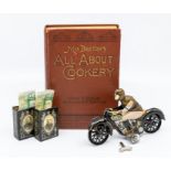A 1960's tin plate motorcycle by Jugdeles, with key, early 20th Century Mrs Beetons cookery book and