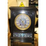 A late 19th Century aesthetic slate bracket clock, having a white enamelled dial, eight day