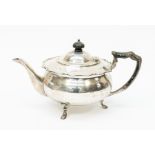 A George V silver melon shaped teapot, cut wavy rim, ebonized finial and handle Sheffield 1918,