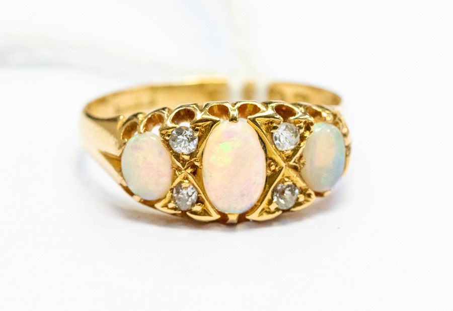 A Victorian opal and diamond ring 18ct gold, comprising three oval opals with alternate diamond - Image 4 of 4