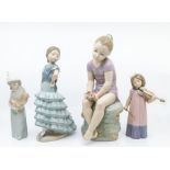 Two Lladro figures of girls along with two Nao figures of girls