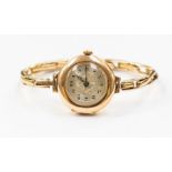 An early 20th Century ladies wristwatch, with an expandable bracelet strap, engine turned face,