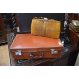 A 1940's lizard skin handbag together with a leather look suitcase (2)