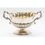 A Victorian silver two handled bon bon dish in the form of a wine cistern, by Henry Matthews,