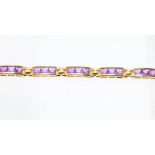 A 14ct gold and amethyst set bracelet, comprising ten rectangular links each channel set with