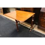 A Victorian mahogany Sutherland table, the central bed raised on turned supports