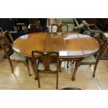 An early 20th Century mahogany dining room suite, comprising a set of four chairs and a dining