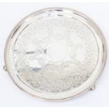 A Victorian silver circular salver, engraved geometric decoration, on three scroll feet, by George