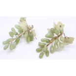 A pair of Chinese jadeite and hardstone realistically carved bunches of grapes with vine leaves (2)